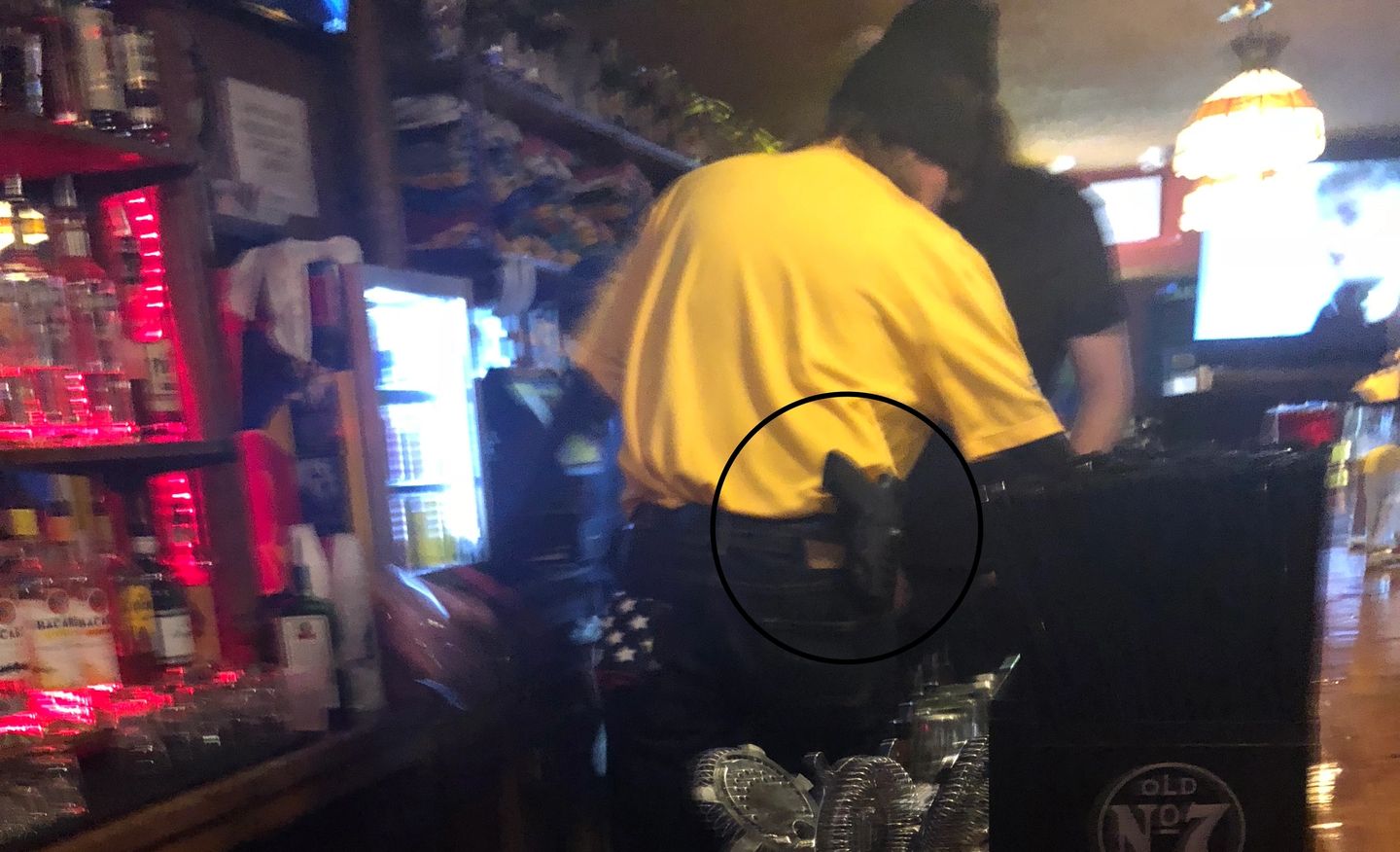 Read more about the article West Virginia bartender pouring beer, wearing open-carry sidearm